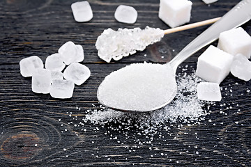 Image showing Sugar white in spoon on black board