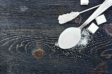 Image showing Sugar white in spoon on black board top