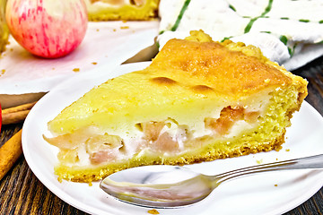 Image showing Pie apple with sour cream in plate on dark board