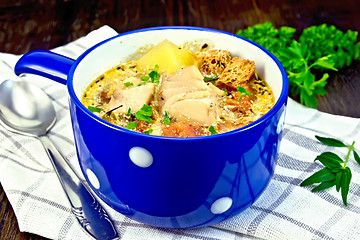 Image showing Soup fish with vegetables and herbs on napkin