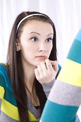 Image showing Teenager Putting on Make Up