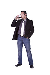 Image showing Businessman celebrating with a glass of drink 