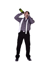 Image showing Businessman drinking straight out of the bottle