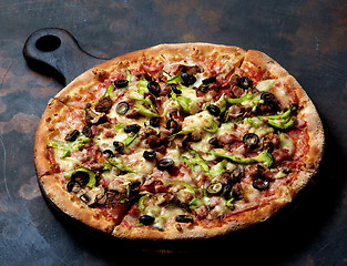 Image showing Delicious Pizza with Ham, Olives and Jalapenos