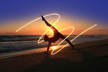 Image showing Skilled Young Dancer at the Beach During Sunset