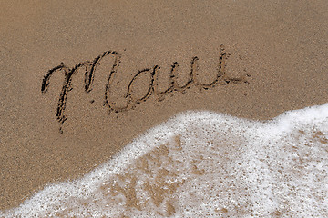 Image showing Word Maui Written Into the Sand With Sea Foam