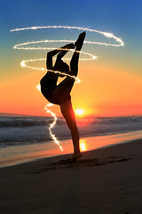 Image showing Skilled Young Dancer at the Beach During Sunset