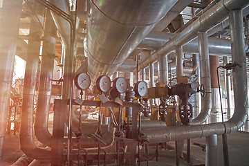 Image showing Equipment, cables and piping as found inside of a modern industr