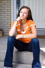 Image showing Teenage Girl Sitting Outside