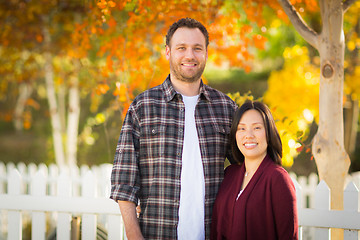 Image showing Outdoor Fall Portrait of Chinese and Caucasian Young Adult Coupl