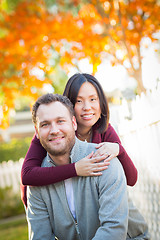 Image showing Outdoor Fall Portrait of Chinese and Caucasian Young Adult Coupl