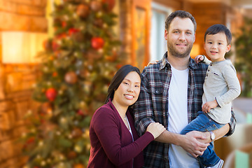 Image showing Mixed Race Chinese and Caucasian Parents and Child Indoors In Fr