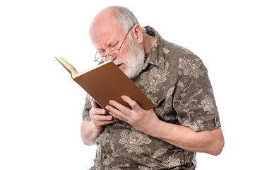 Image showing Senior man with glasses reading a book