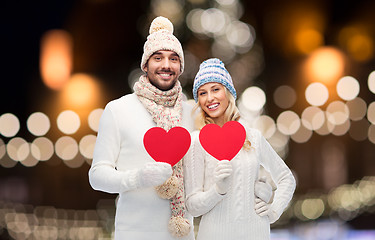 Image showing couple with red hearts over christmas lights