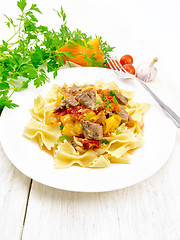 Image showing Farfalle with turkey and vegetables on light board