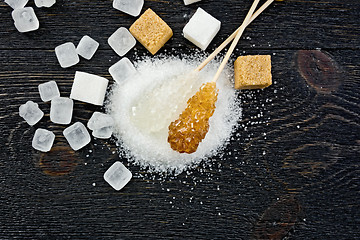 Image showing Sugar white and brown crystal on board top