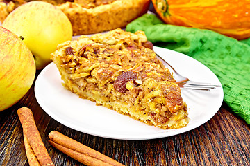 Image showing Pie with pumpkin and apples on board