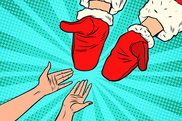 Image showing Hand of Santa Claus and women