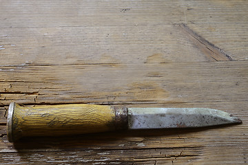 Image showing traditional Finnish knife puukko on  a wooden