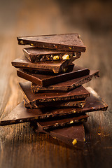 Image showing Stack chocolate on wooden table