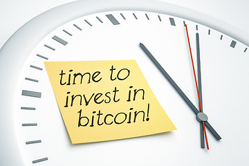 Image showing clock with sticky note time to invest in bitcoin