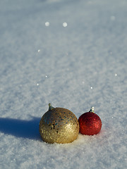 Image showing christmas balls decoration in snow