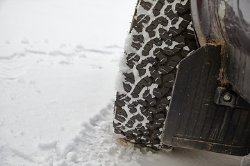 Image showing Car tyre in snow