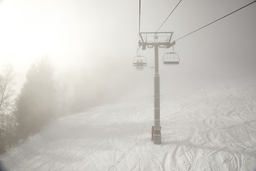 Image showing Ski lift in the clouds