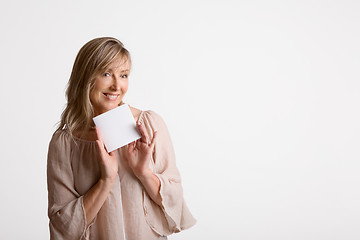 Image showing Woman showing holding blank card, note, message