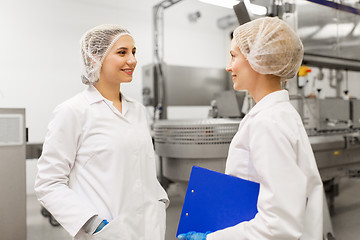 Image showing happy women technologists at ice cream factory