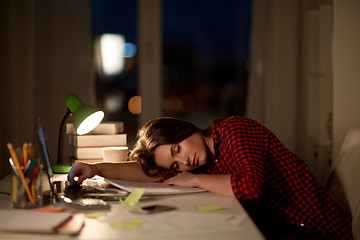 Image showing student or woman sleeping on table at night home