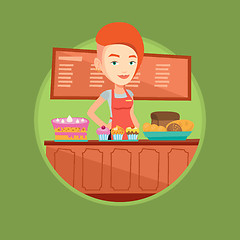 Image showing Worker standing behind the counter at the bakery.