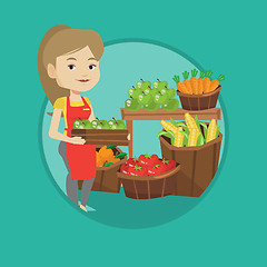 Image showing Supermarket worker with box full of apples.