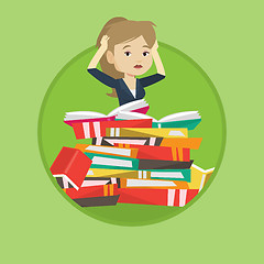 Image showing Student sitting in huge pile of books.