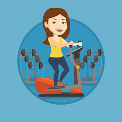 Image showing Woman exercising on elliptical trainer.