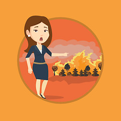 Image showing Woman standing on background of wildfire.