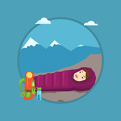 Image showing Woman resting in sleeping bag in the mountains.