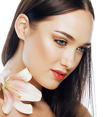 Image showing young attractive lady close up with hands on face isolated flower lily brunette spa nude makeup macro