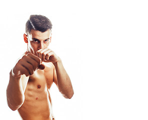 Image showing young handsome naked torso man boxing on white background isolat