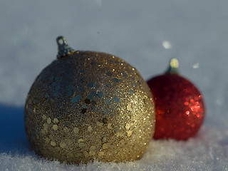 Image showing christmas balls decoration in snow