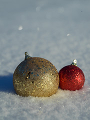 Image showing christmas balls decoration in snow