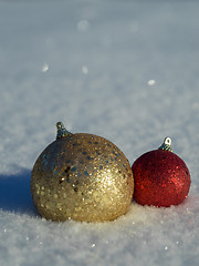 Image showing christmas balls decoration in snow
