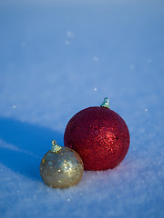 Image showing christmas balls decoration in snow