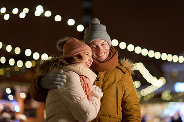 Image showing happy couple hugging at christmas tree