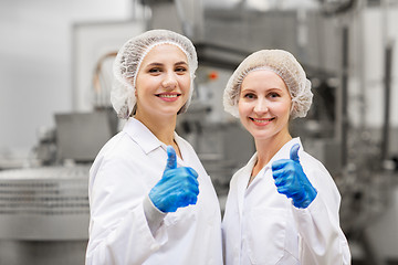 Image showing happy women technologists at ice cream factory