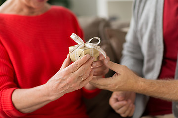 Image showing close up of senior couple with christmas gift