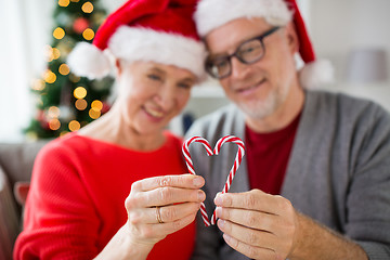 Image showing senior couple with heart of christmas candy canes