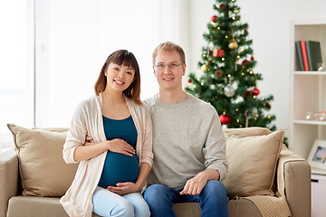 Image showing pregnant wife with husband at home at christmas