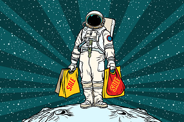 Image showing Lone retro astronaut with a sale shopping bags