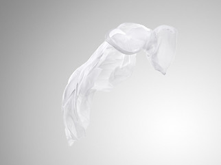 Image showing Smooth elegant transparent white cloth separated on gray background.